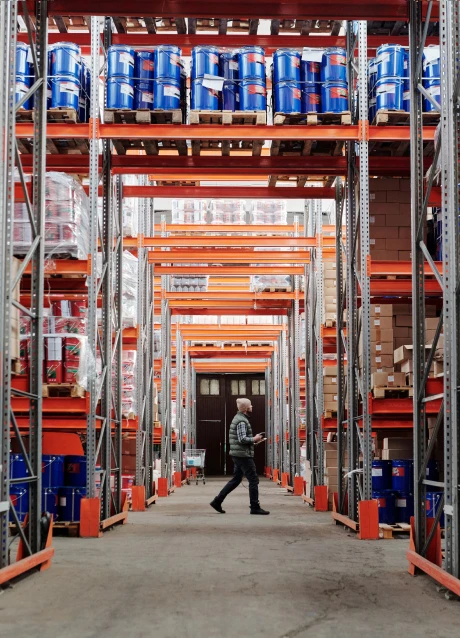 Warehouse worker managing inventory and materials in a manufacturing facility
