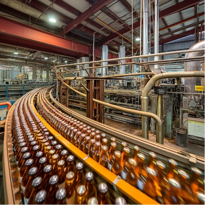 Manufacturing production line with bottles moving through a factory