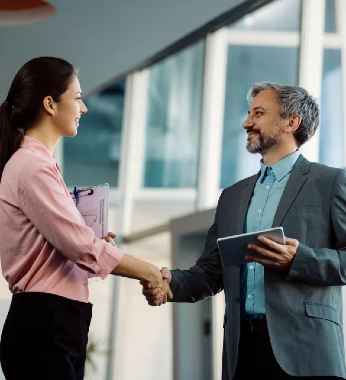 Business professionals shaking hands in an office