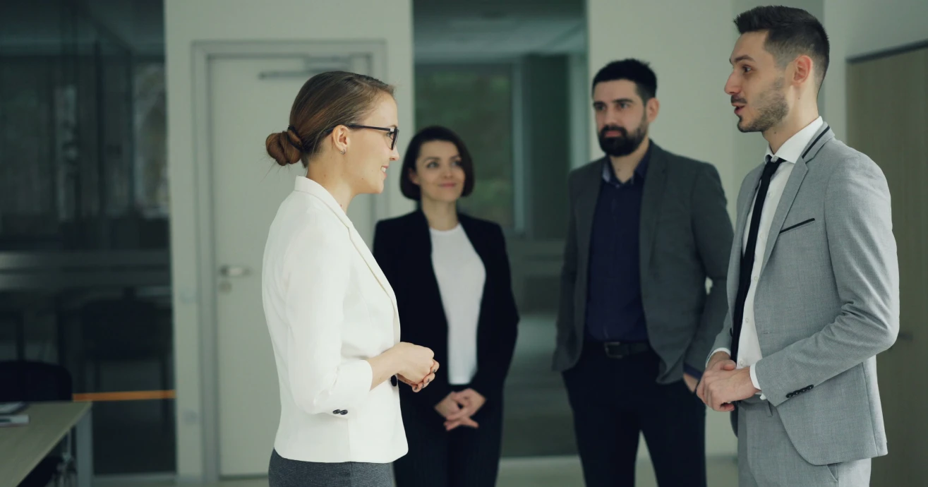 Business professionals discussing a project in an office