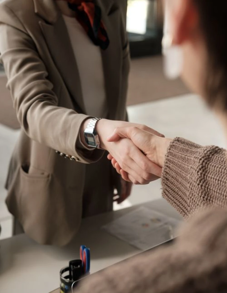 Healthcare professionals shaking hands during a meeting