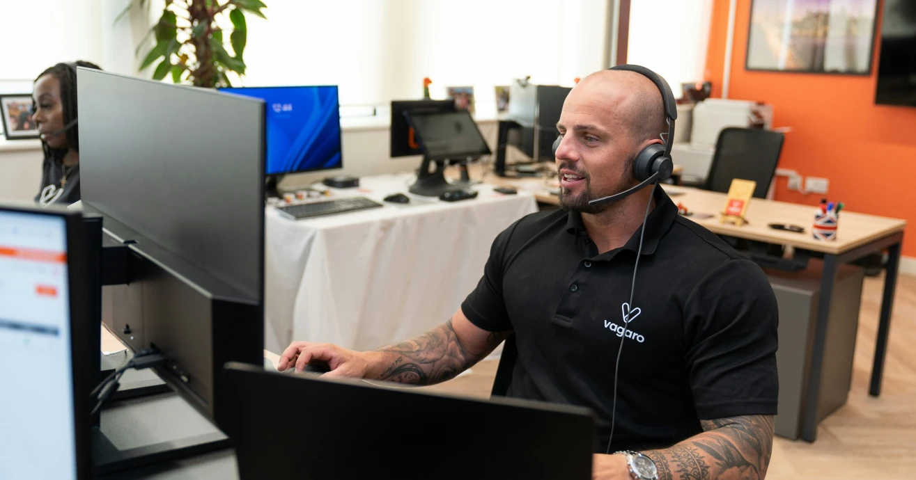 Technical support professional working at a computer