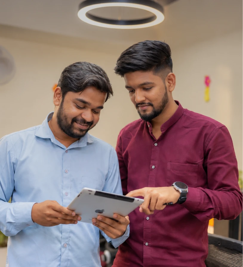 Two professionals discussing together on a tab