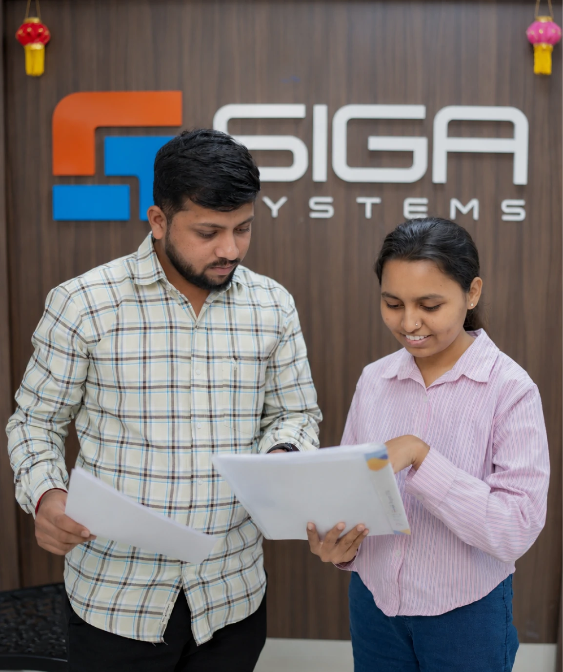 SiGa Systems team members reviewing information together