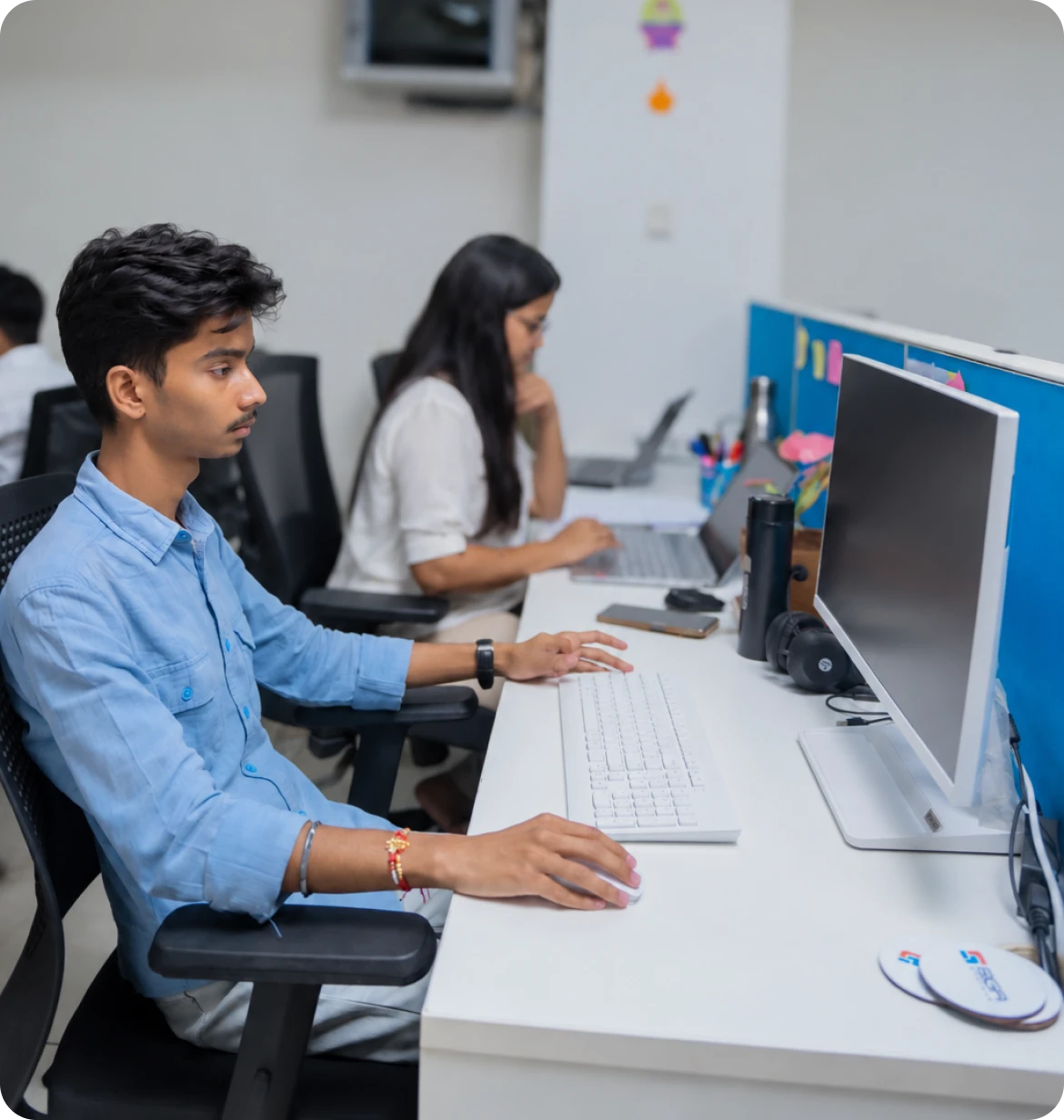 Software team members working at computers in an office